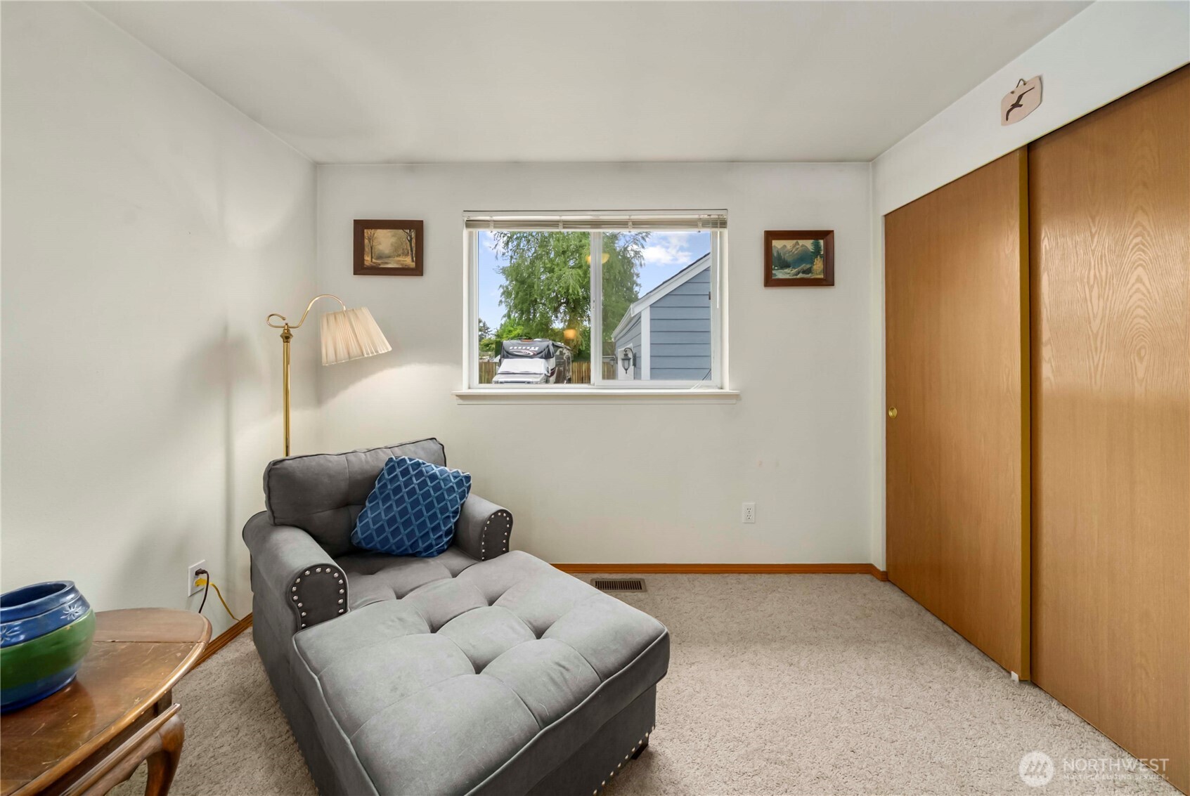 1010 Academy Street Sumner, WA 98390 - Photo 21 of 37 a living room with furniture and a window