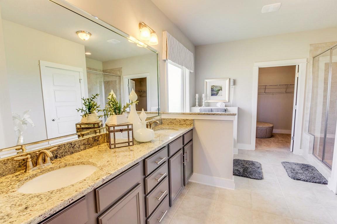 329 Merlin Court Crestview, FL 32539 - Photo 8 of 16 a bathroom with a granite countertop sink and a mirror