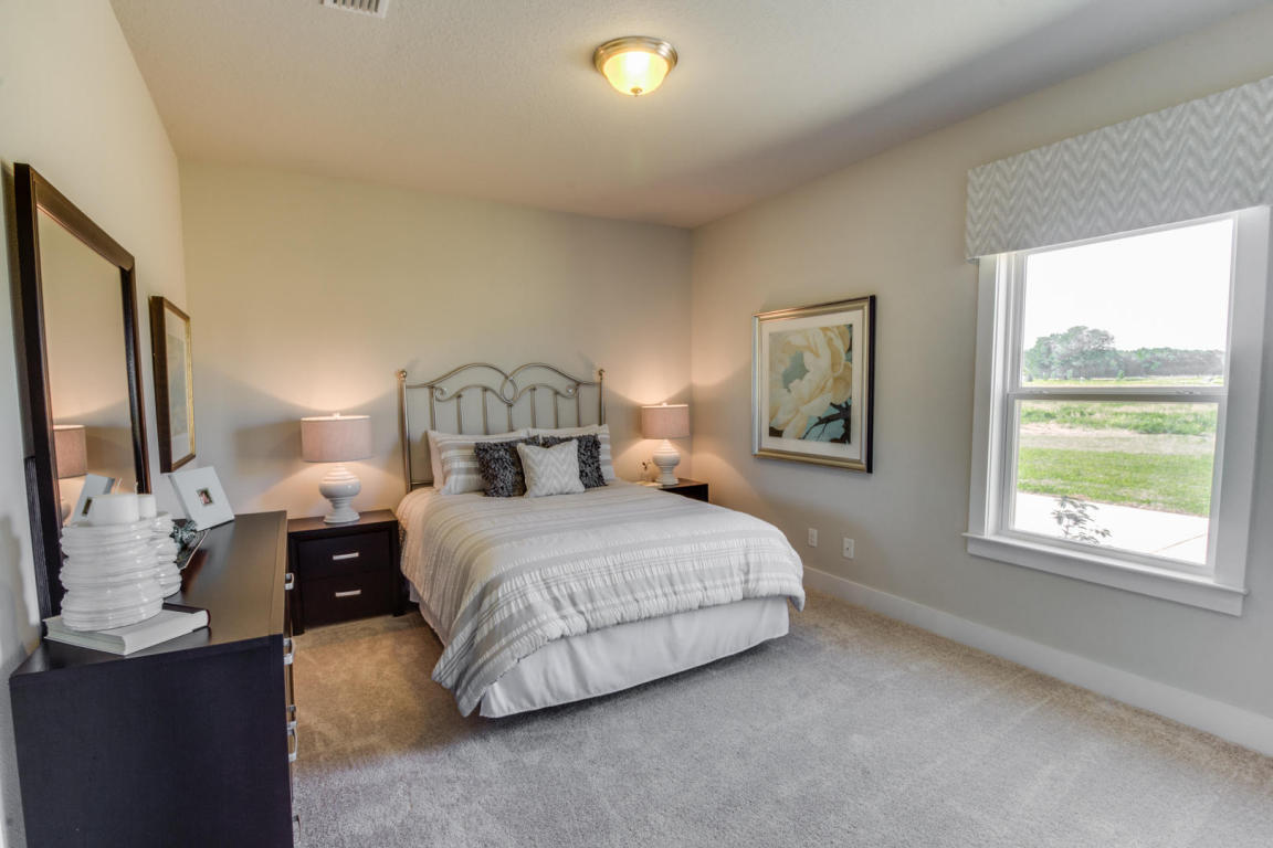 329 Merlin Court Crestview, FL 32539 - Photo 9 of 16 a bedroom with a bed and a window