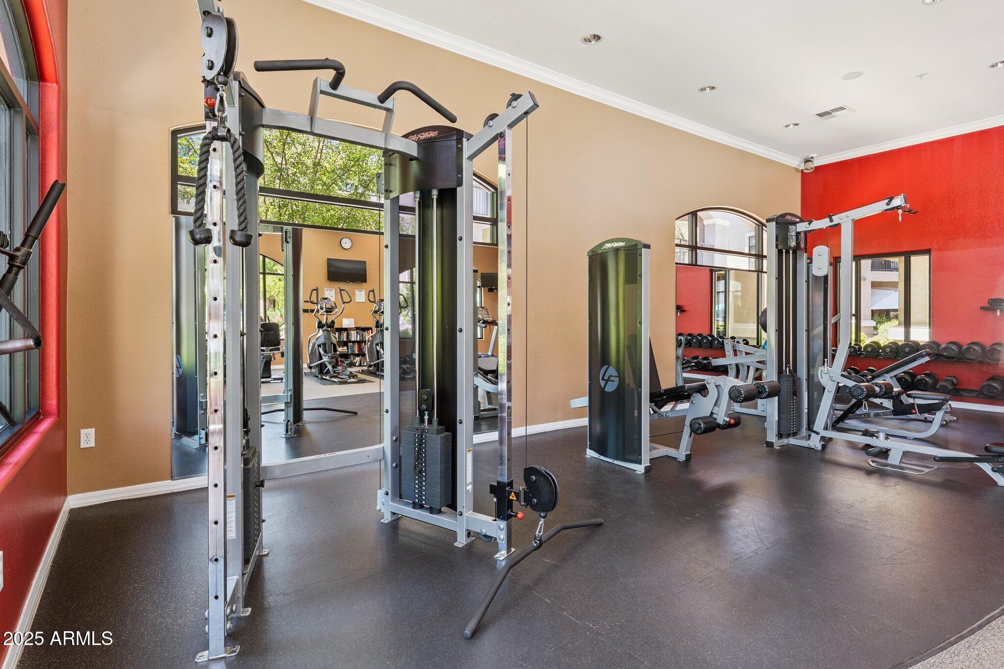11640 North Tatum Boulevard, Unit 2079 Phoenix, AZ 85028 - Photo 10 of 48 a view of a room with gym equipment