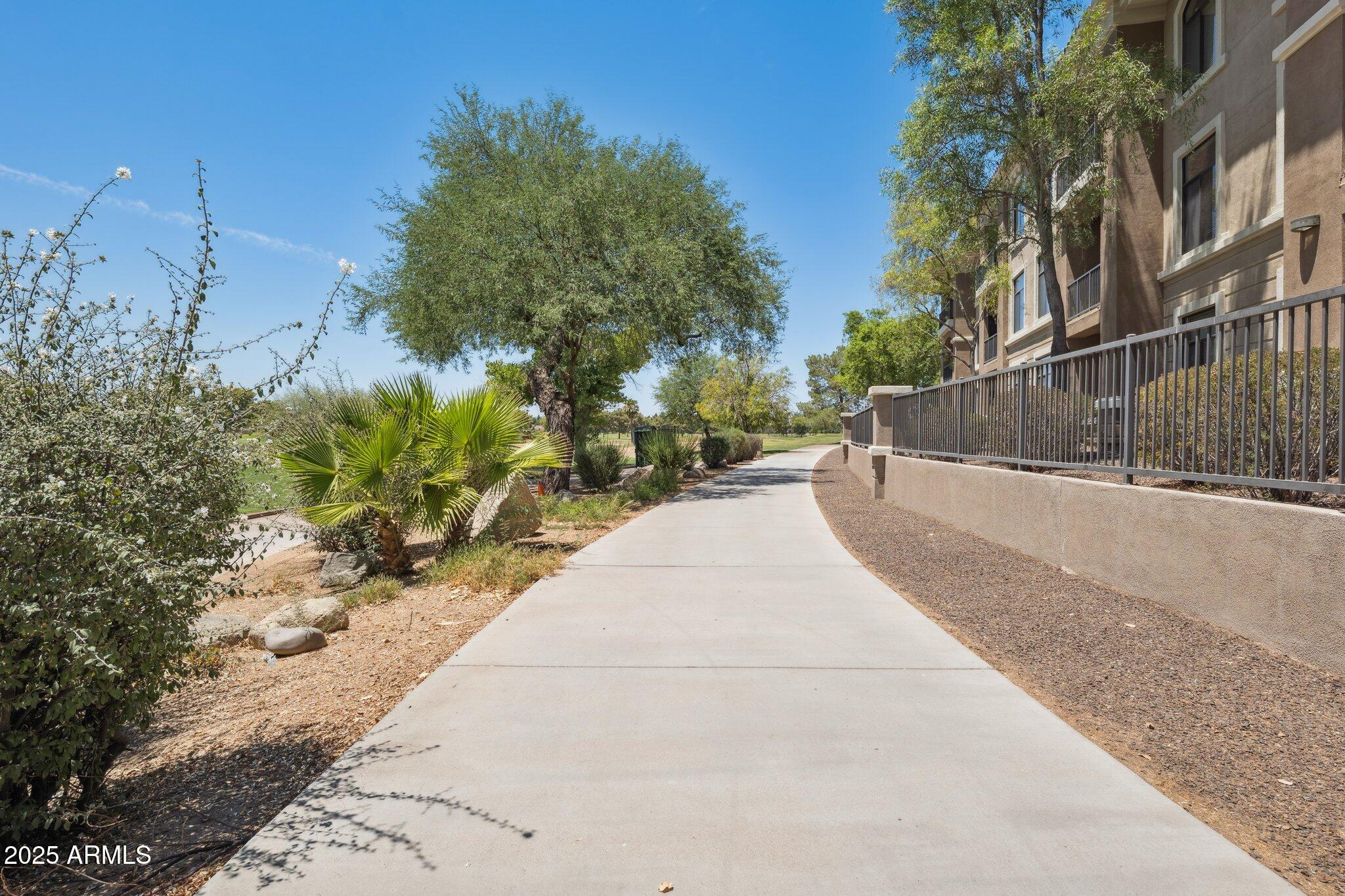 11640 North Tatum Boulevard, Unit 2079 Phoenix, AZ 85028 - Photo 12 of 48 a view of a pathway with a yard