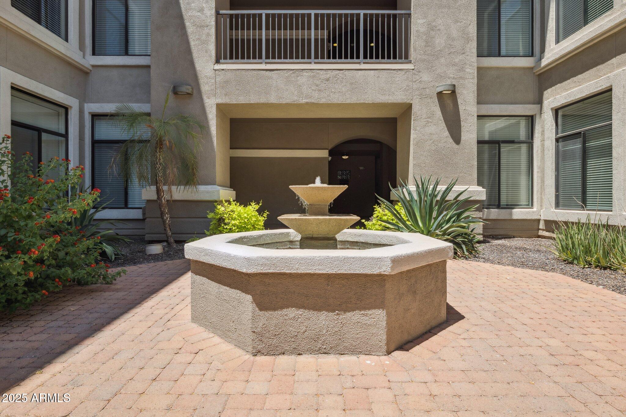11640 North Tatum Boulevard, Unit 2079 Phoenix, AZ 85028 - Photo 13 of 48 a view of a house with sitting area and fire pit