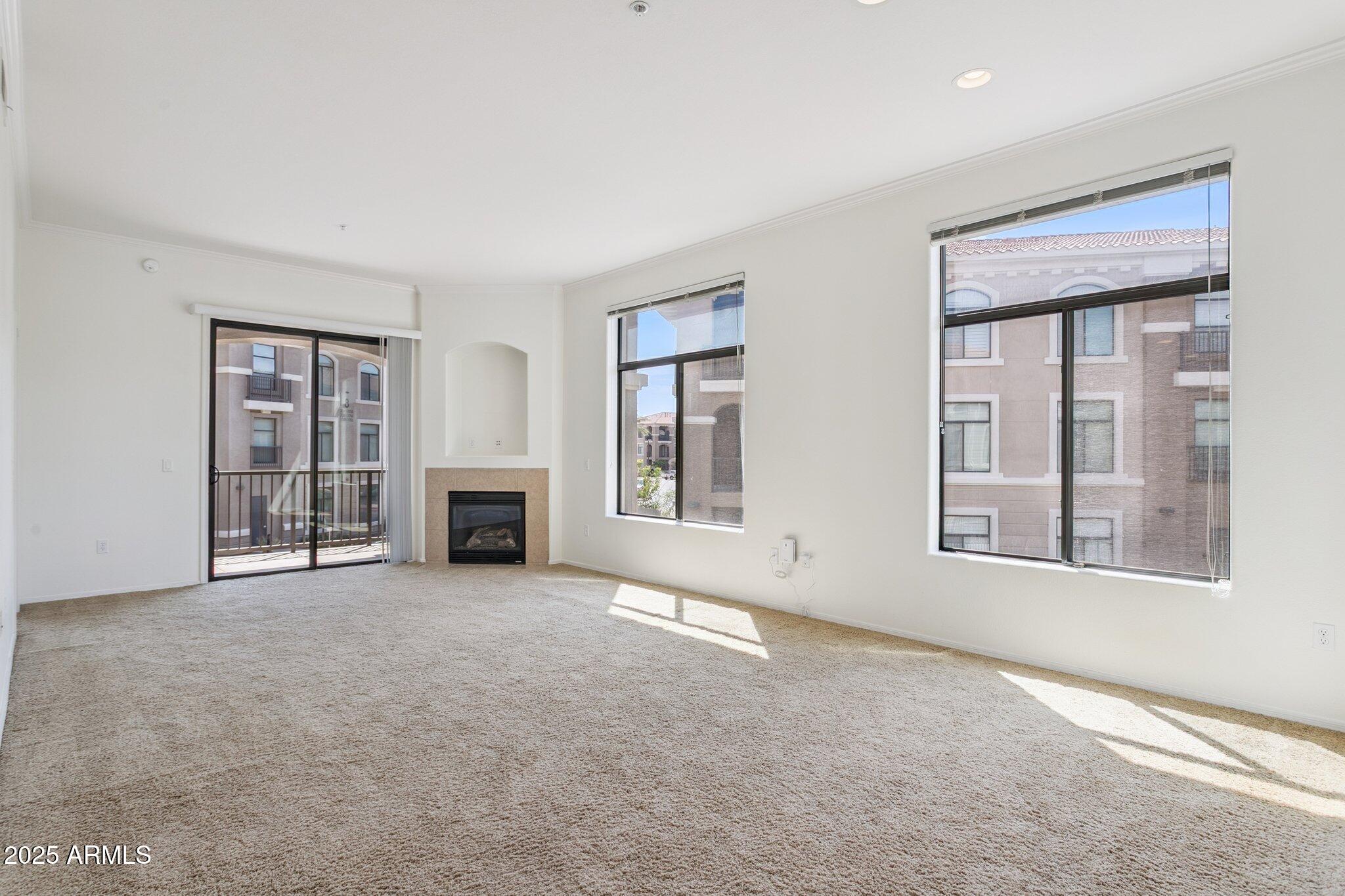 11640 North Tatum Boulevard, Unit 2079 Phoenix, AZ 85028 - Photo 15 of 48 a view of a windows and fireplace in an empty room