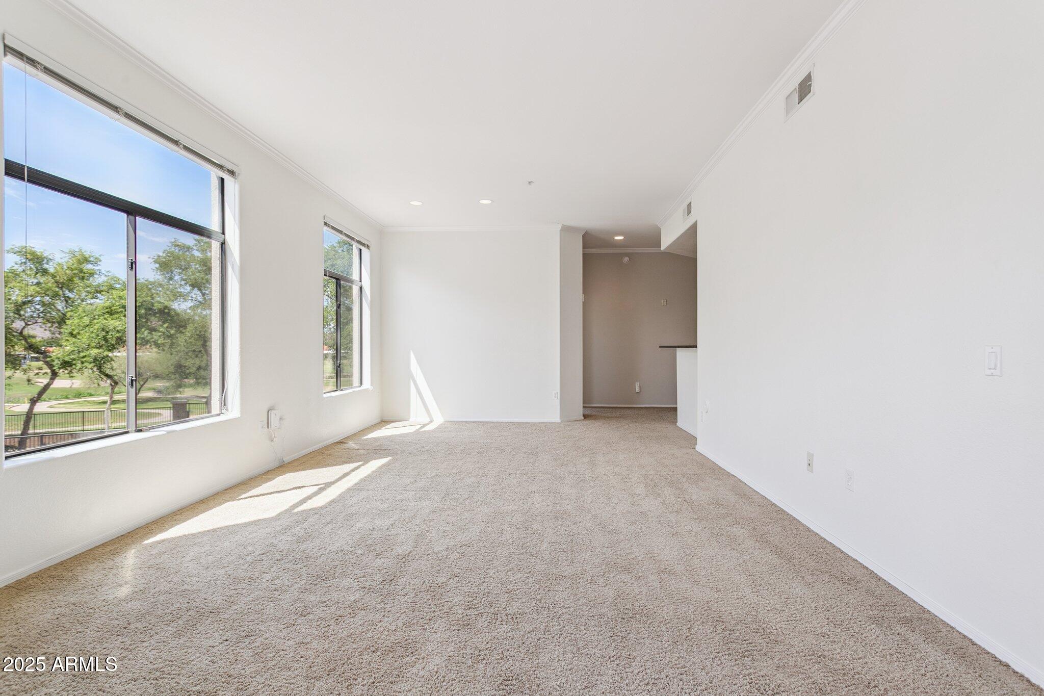 11640 North Tatum Boulevard, Unit 2079 Phoenix, AZ 85028 - Photo 18 of 48 a view of an empty room with a window