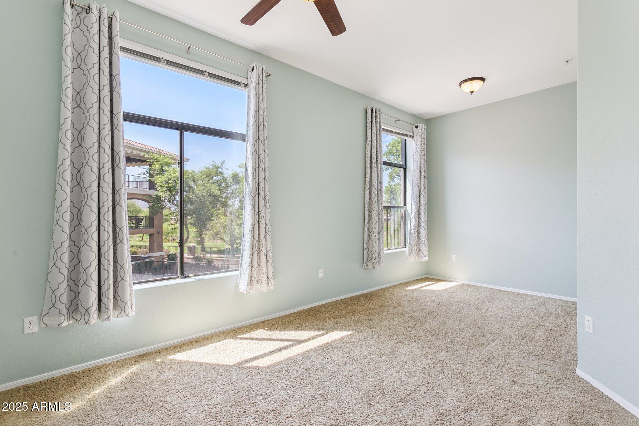 11640 North Tatum Boulevard, Unit 2079 Phoenix, AZ 85028 - Photo 26 of 48 a view of an empty room with a window