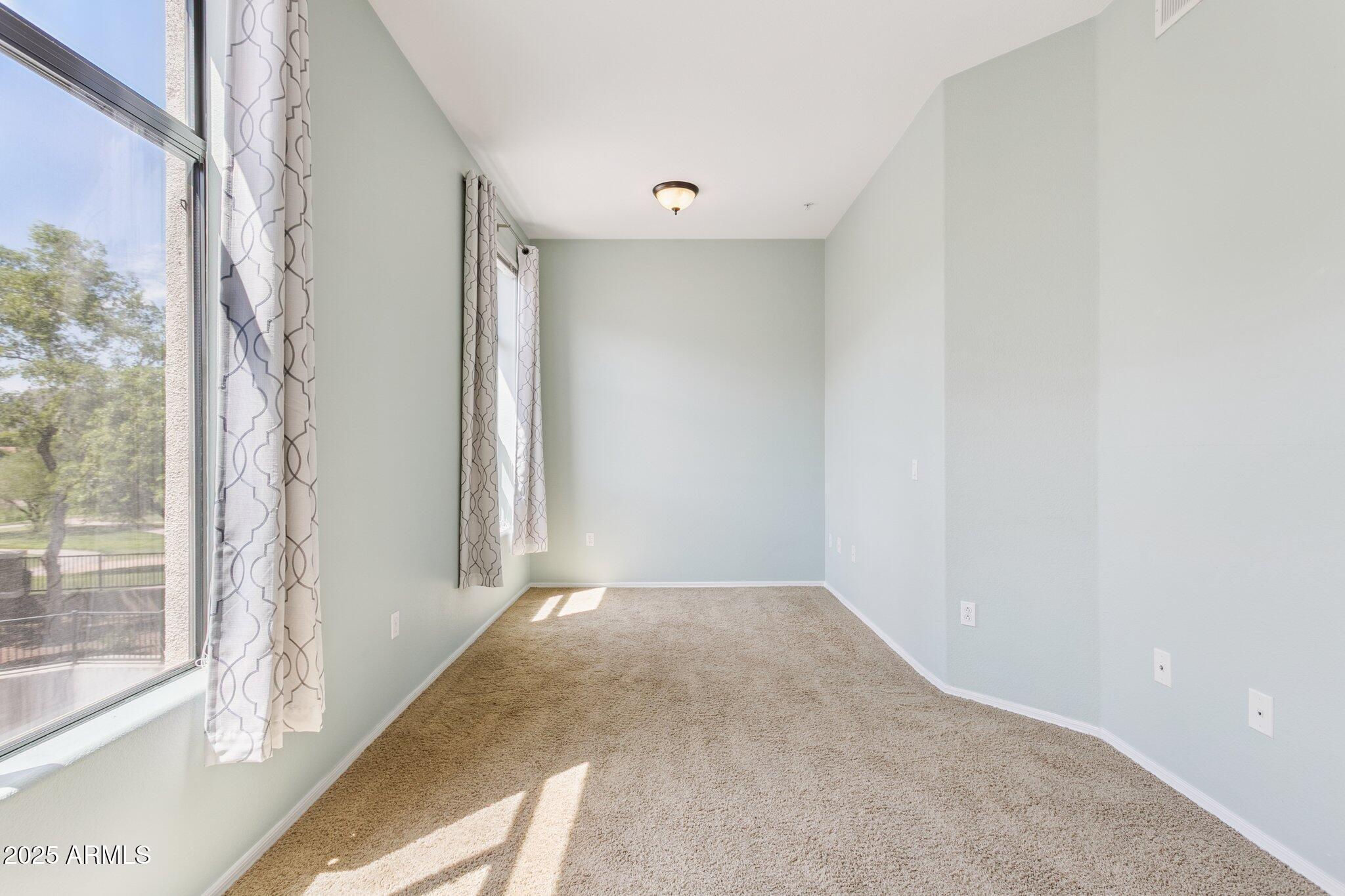 11640 North Tatum Boulevard, Unit 2079 Phoenix, AZ 85028 - Photo 27 of 48 a view of a big room with windows and entryway