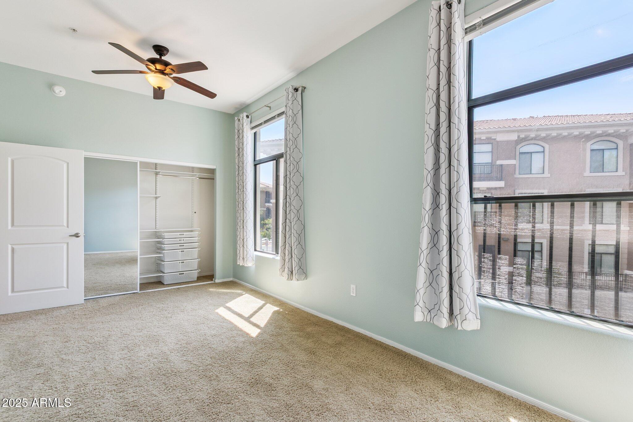 11640 North Tatum Boulevard, Unit 2079 Phoenix, AZ 85028 - Photo 29 of 48 a view of an empty room with a window