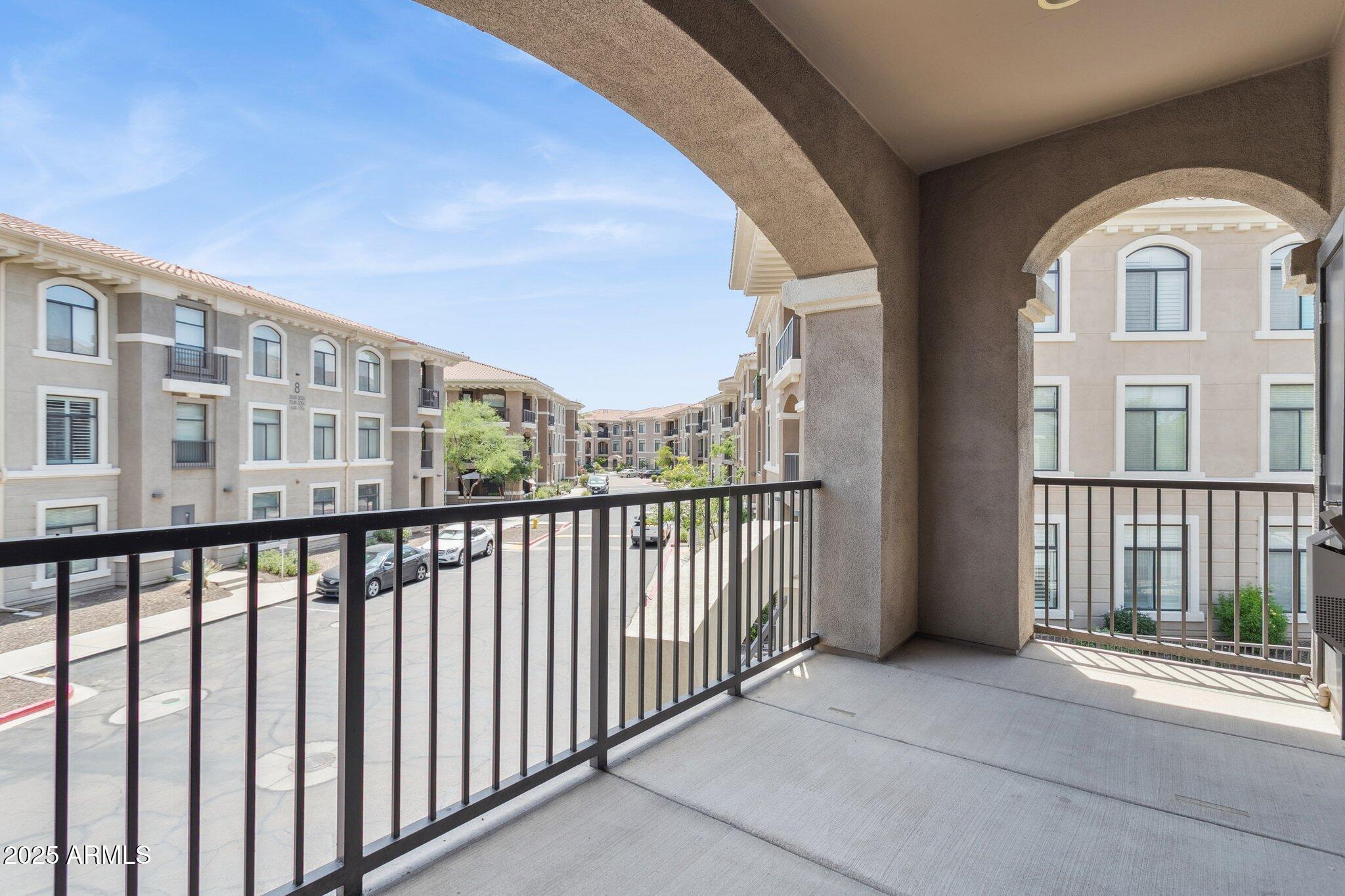 11640 North Tatum Boulevard, Unit 2079 Phoenix, AZ 85028 - Photo 32 of 48 a view of a large building from a balcony