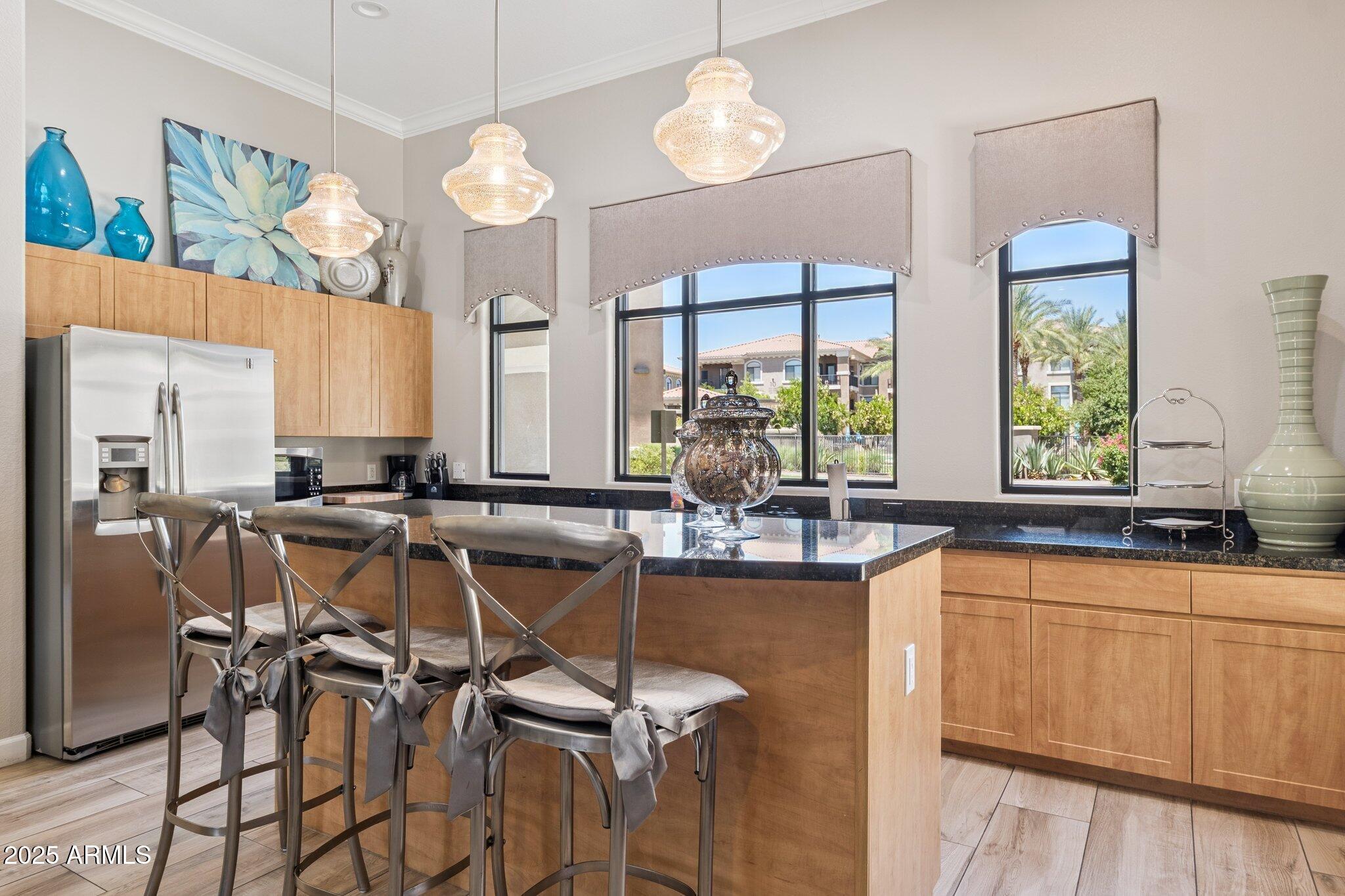 11640 North Tatum Boulevard, Unit 2079 Phoenix, AZ 85028 - Photo 41 of 48 a view of a kitchen with granite countertop a sink cabinets and window