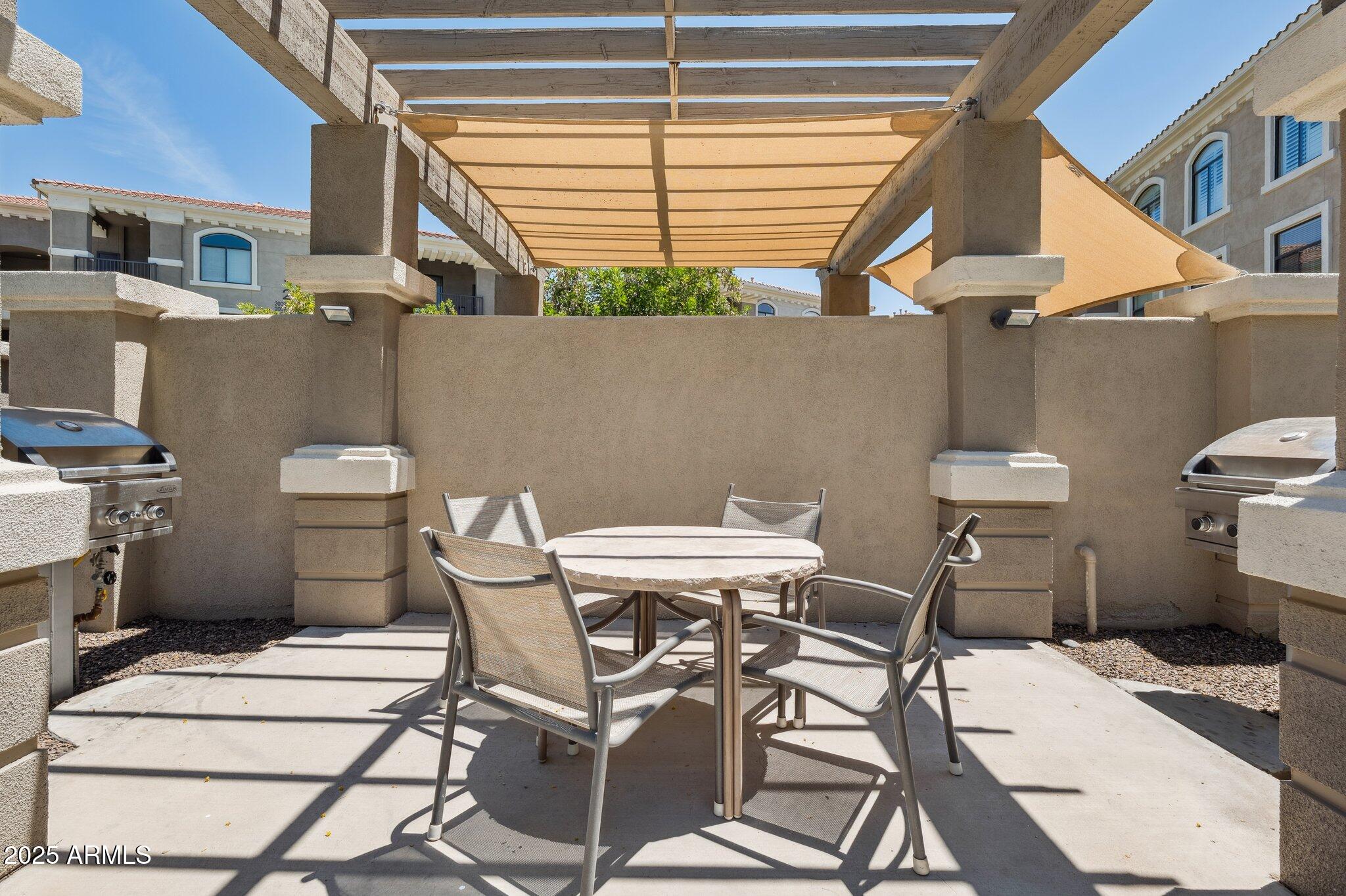 11640 North Tatum Boulevard, Unit 2079 Phoenix, AZ 85028 - Photo 42 of 48 a table and chairs in a room