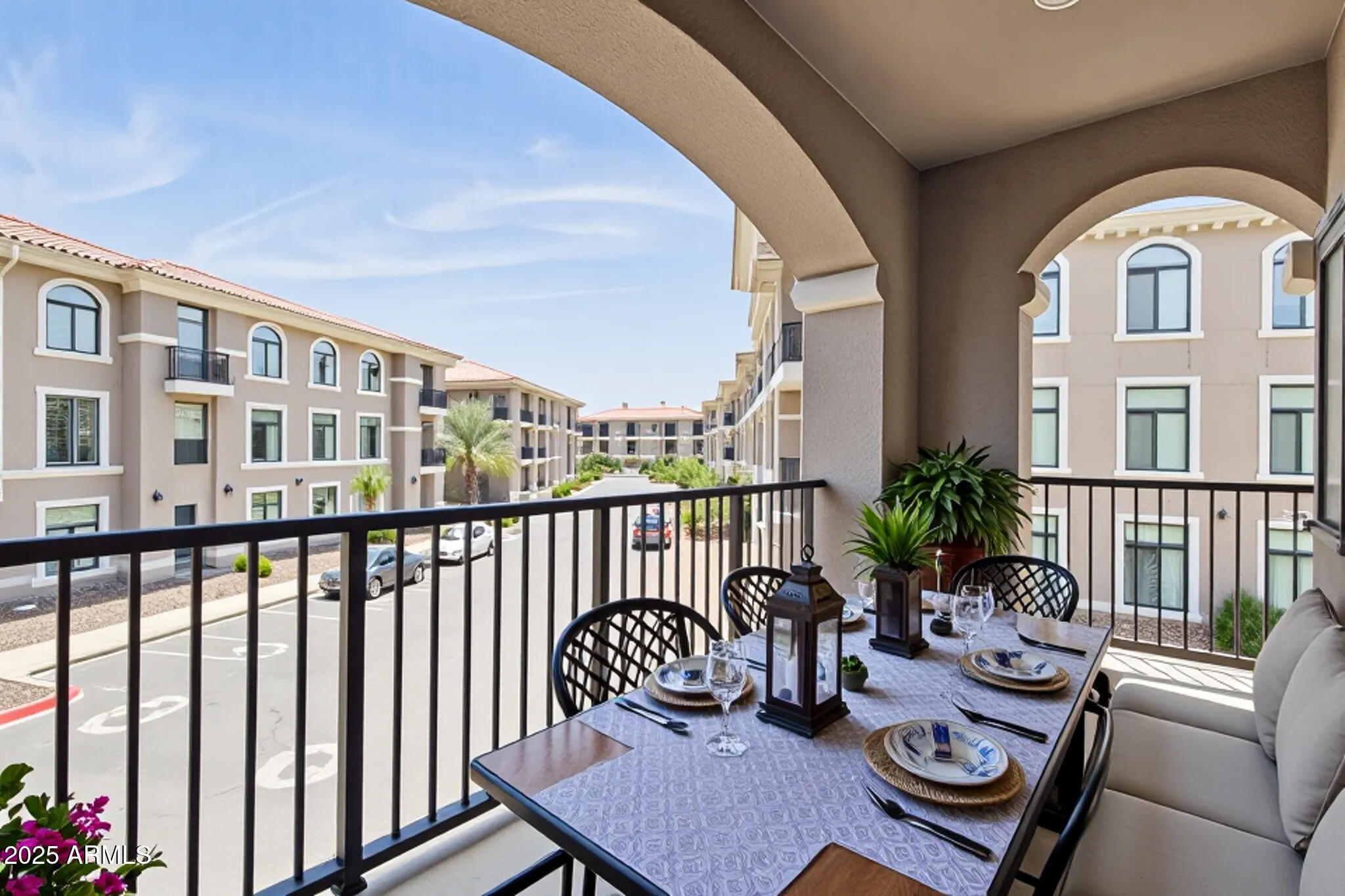 11640 North Tatum Boulevard, Unit 2079 Phoenix, AZ 85028 - Photo 5 of 48 a view of a balcony with chairs and a potted plant