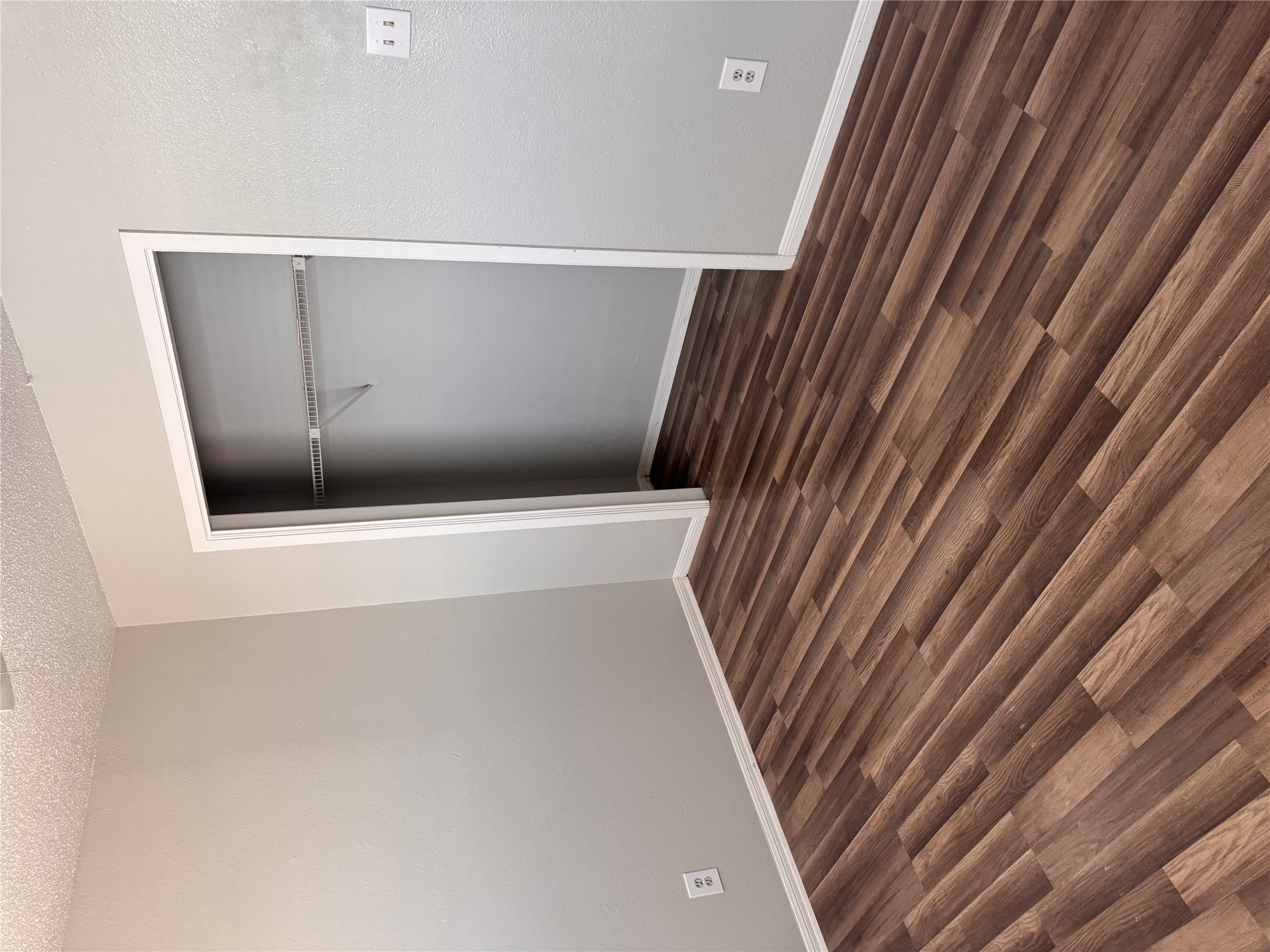 8807 Schick Road, Unit D Austin, TX 78729 - Photo 21 of 23 A quiet bedroom showcases durable wood-look flooring and convenient closet storage.