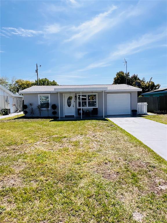 4846 Rosedale Lane Holiday, FL 34690 - Photo 1 of 1 a view of a house with a big yard and large trees
