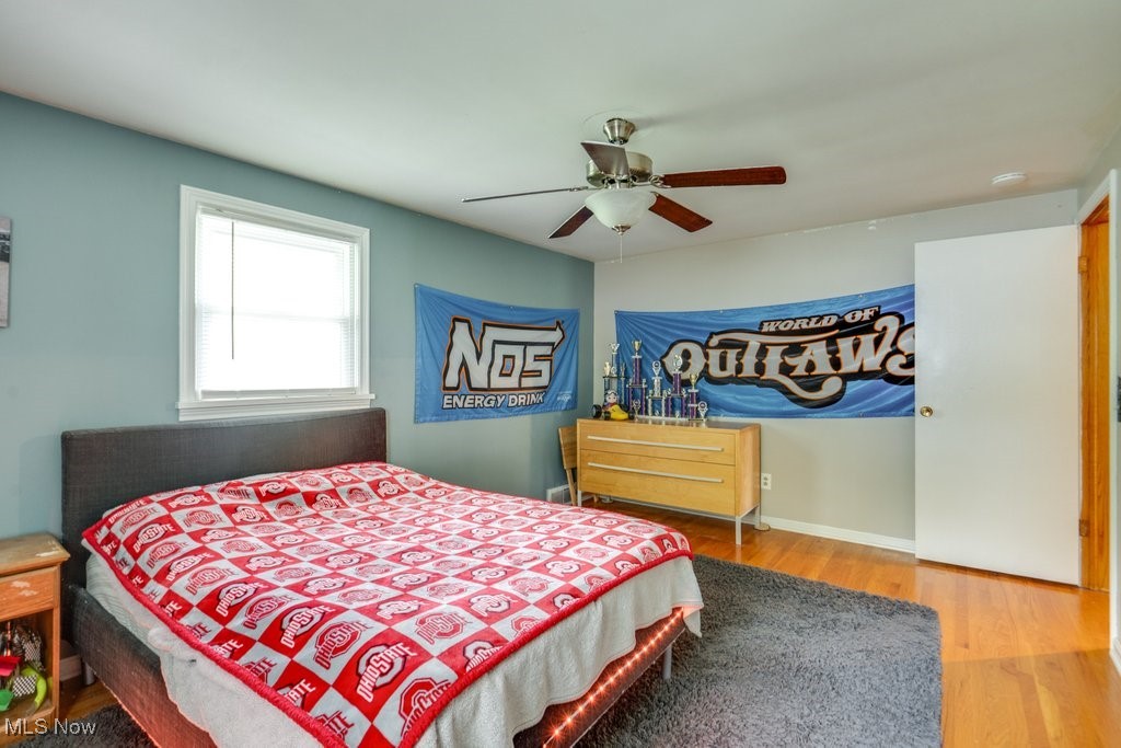 5867 Wiclif Road Northeast Canton, OH 44721 - Photo 30 of 45 Bedroom featuring wood finished floors and a ceiling fan