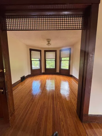 wooden floor in a hall with an entryway