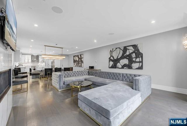 1234 River Road Edgewater, NJ 07020 - Photo 11 of 29 a living room with furniture and view of kitchen