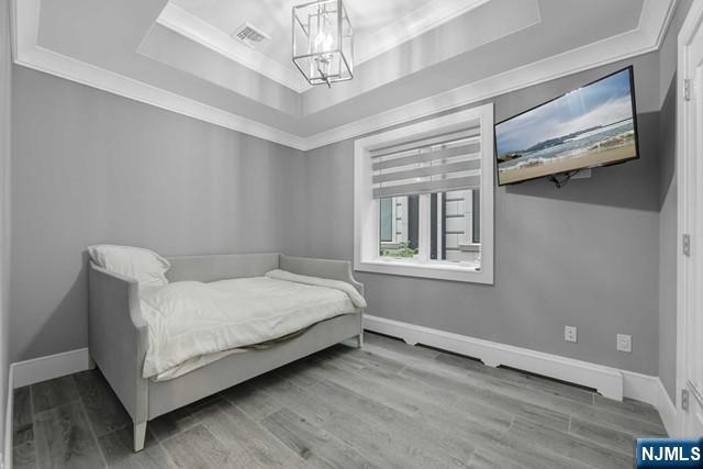 1234 River Road Edgewater, NJ 07020 - Photo 20 of 29 a living room with a bed furniture and a window