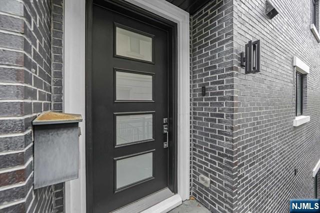 1234 River Road Edgewater, NJ 07020 - Photo 2 of 29 a bathroom with a toilet and a shower