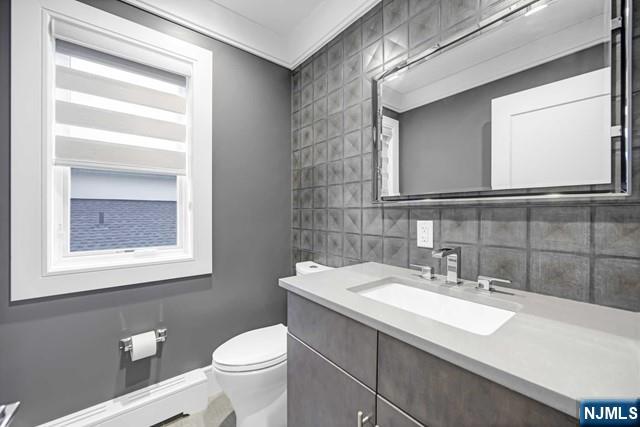 1234 River Road Edgewater, NJ 07020 - Photo 27 of 29 a bathroom with a sink and a toilet