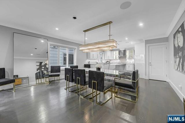 1234 River Road Edgewater, NJ 07020 - Photo 10 of 29 a room with lots of chairs and wooden floors