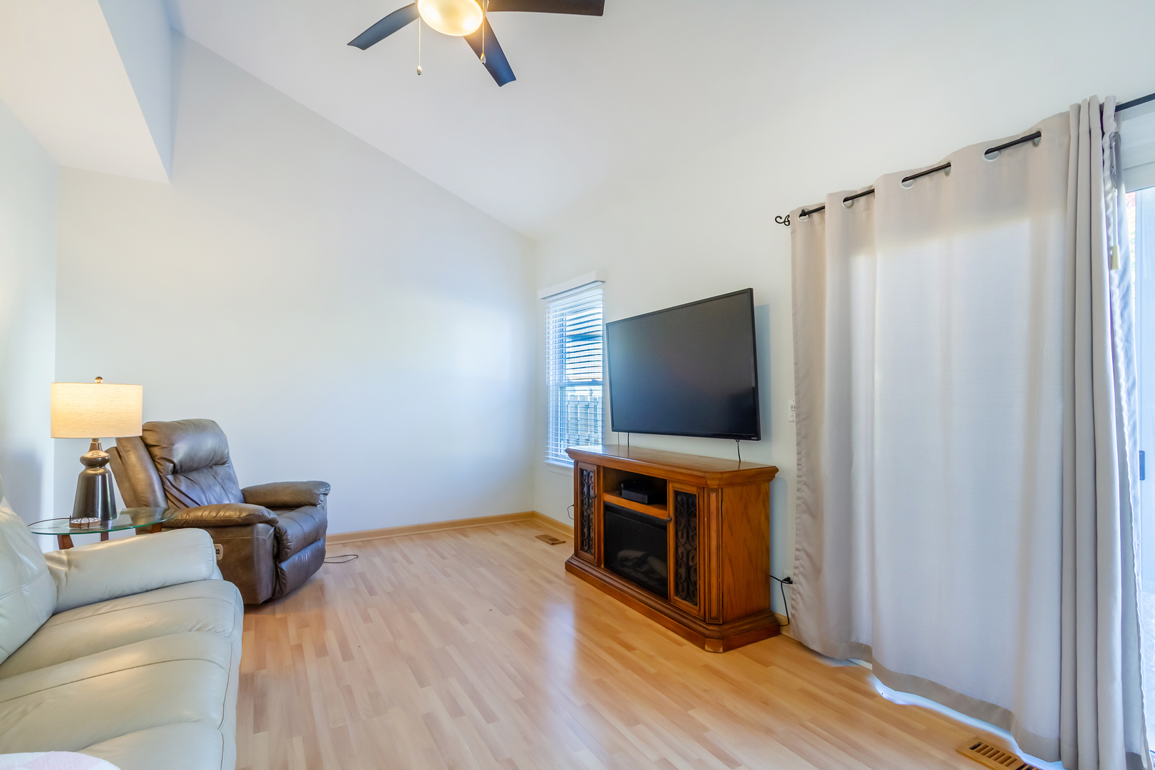 1734 Somerfield Lane Crystal Lake, IL 60014 - Photo 11 of 25 a living room with furniture and a flat screen tv
