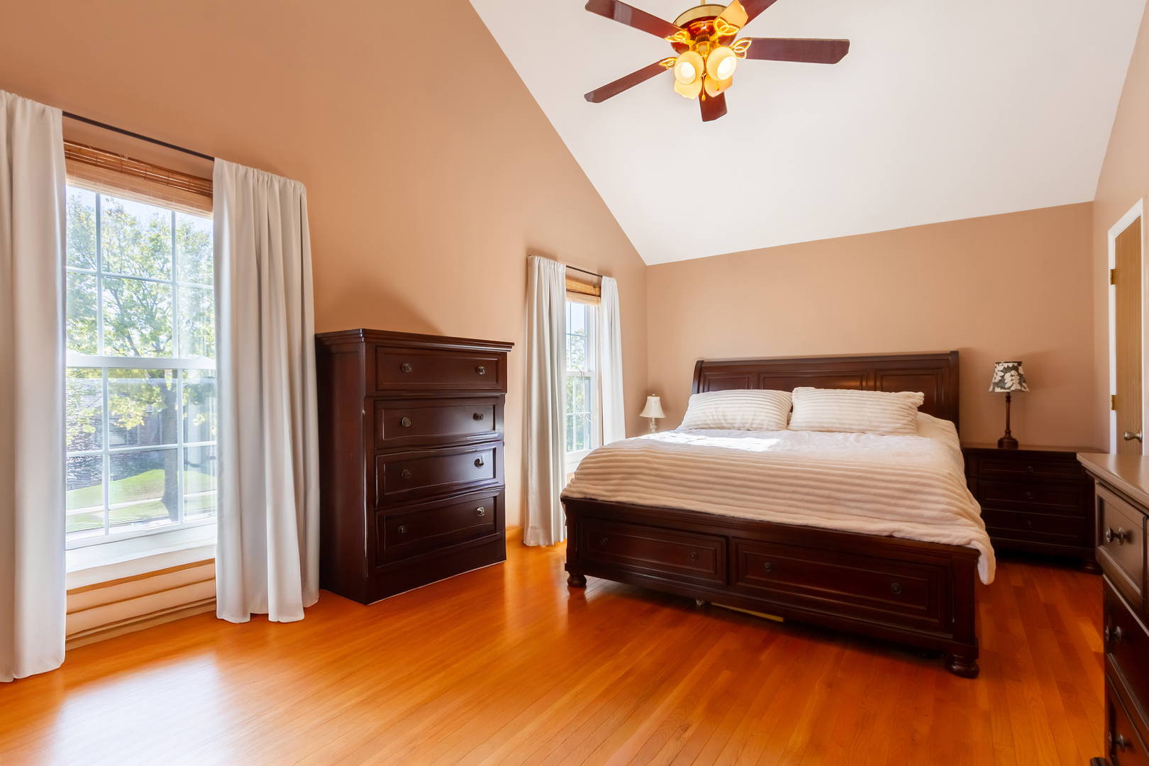 1734 Somerfield Lane Crystal Lake, IL 60014 - Photo 17 of 25 a bedroom with a bed and a chandelier