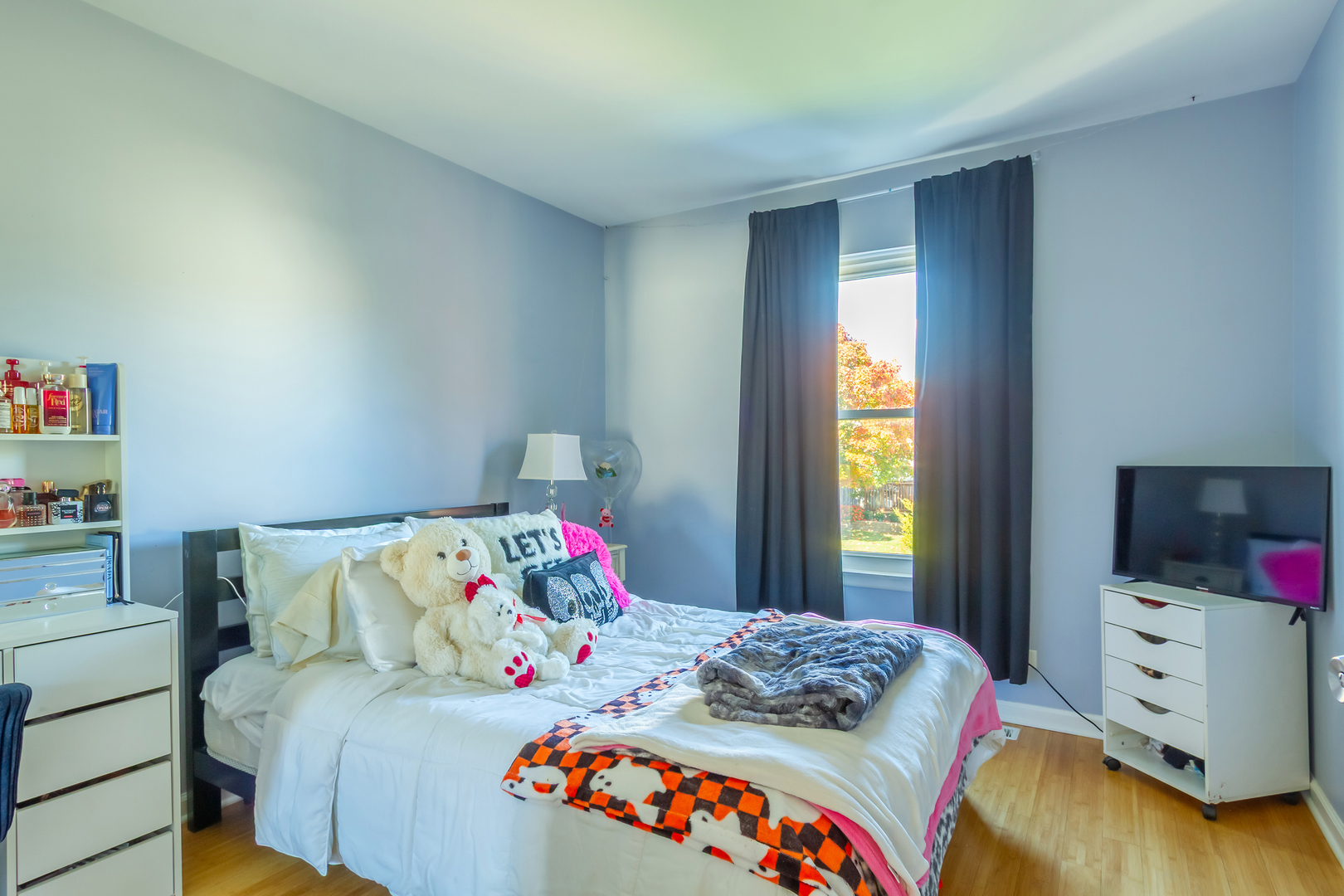 1734 Somerfield Lane Crystal Lake, IL 60014 - Photo 19 of 25 a bedroom with a bed and a flat tv screen on the dresser