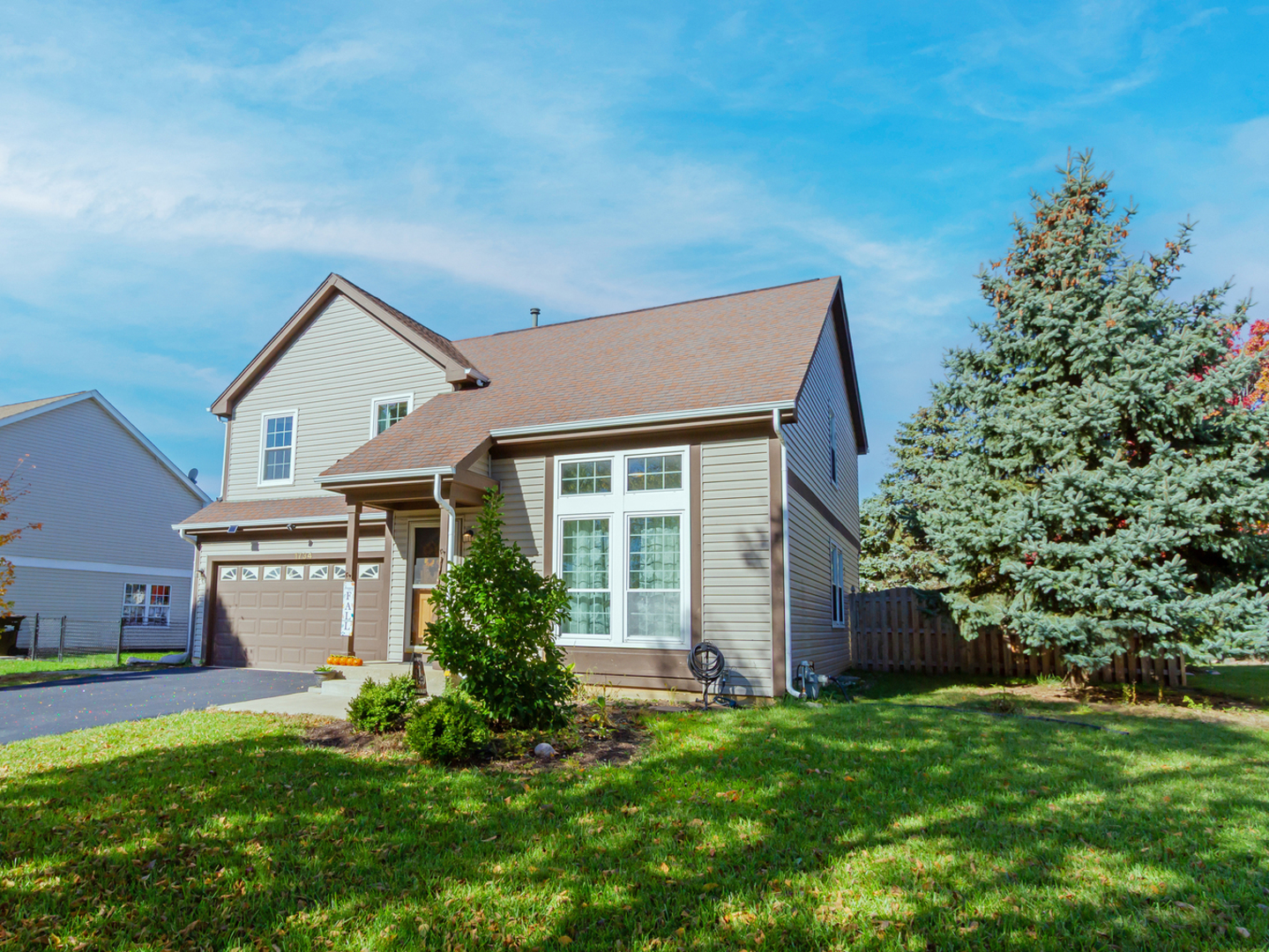 1734 Somerfield Lane Crystal Lake, IL 60014 - Photo 2 of 25 front view of a house with a yard and an trees