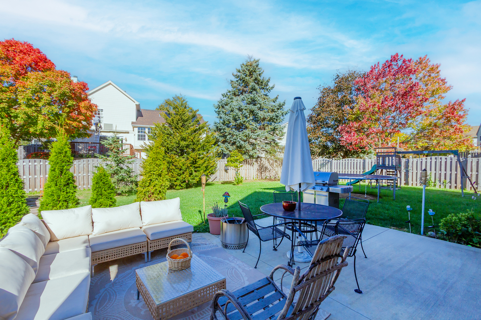 1734 Somerfield Lane Crystal Lake, IL 60014 - Photo 25 of 25 a view of a patio with couches table and chairs and potted plants