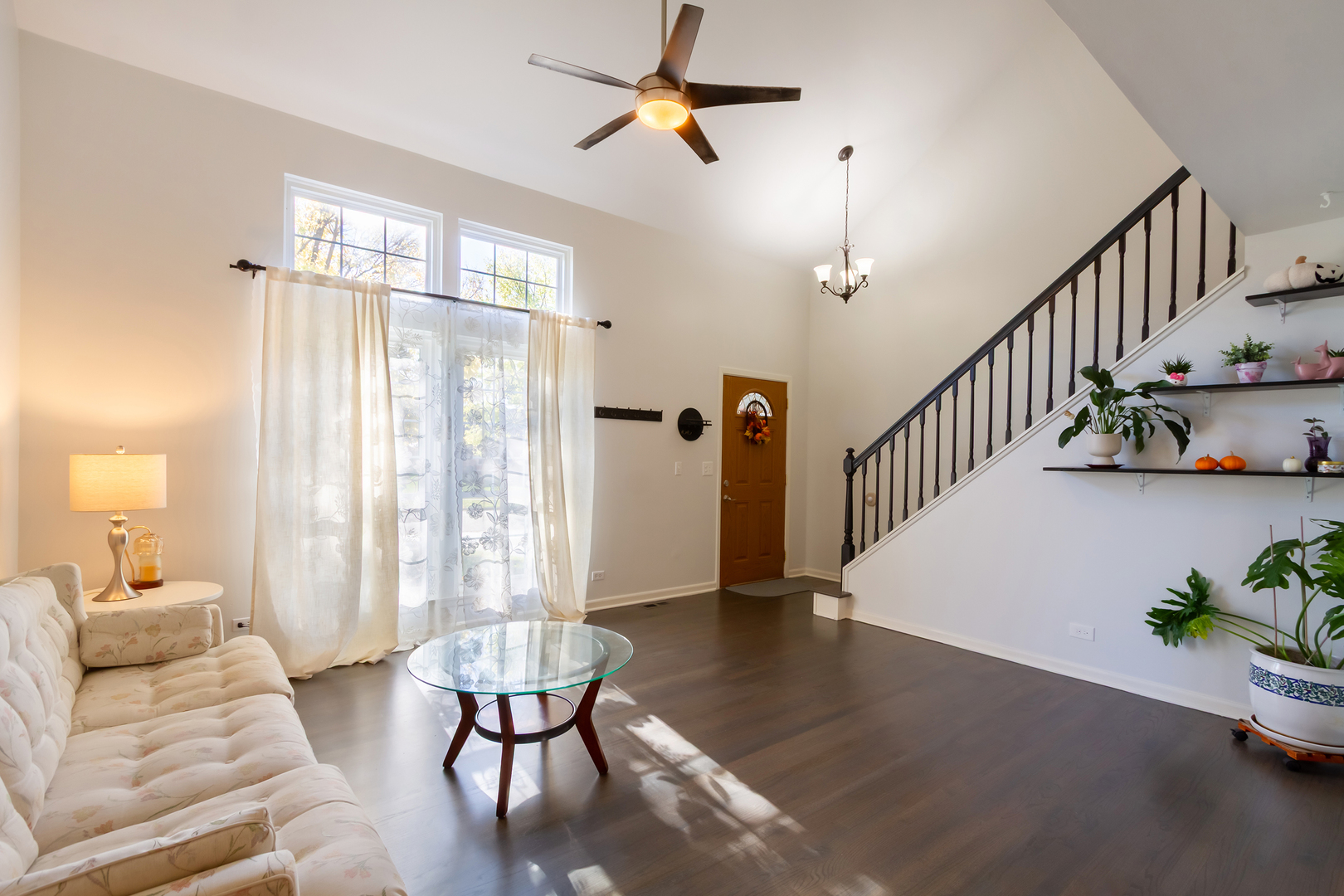 1734 Somerfield Lane Crystal Lake, IL 60014 - Photo 3 of 25 a living room with furniture and a chandelier