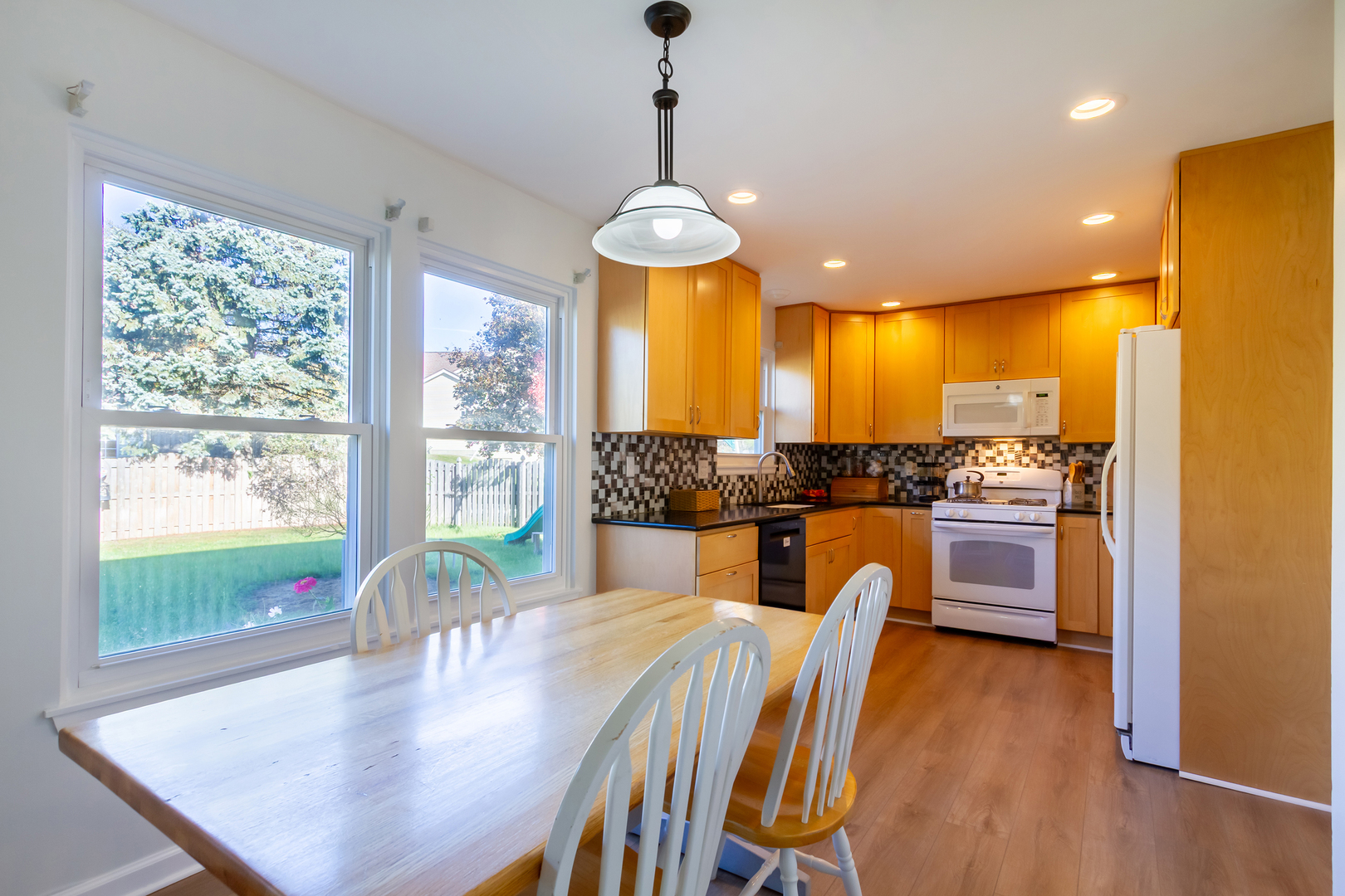 1734 Somerfield Lane Crystal Lake, IL 60014 - Photo 9 of 25 a view of a dining room with furniture window and outside view