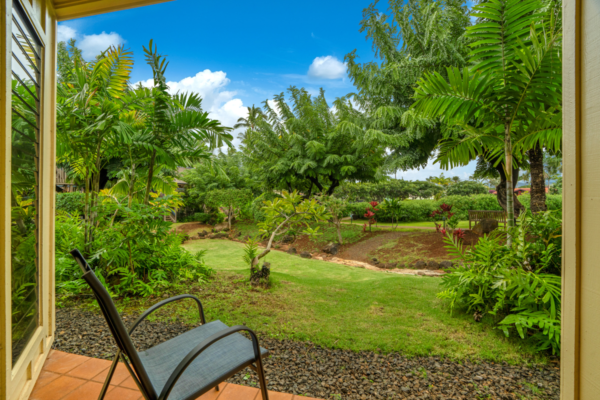 1870 Hoone Road, Unit 602 Koloa, HI 96756 - Photo 17 of 26 a backyard of a house with lots of green space and lake view
