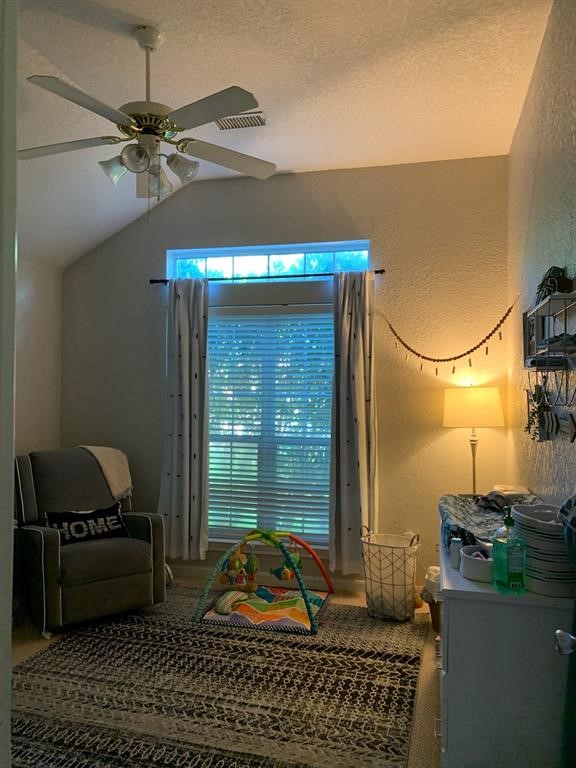 254 Maple Lane Conroe, TX 77304 - Photo 17 of 27 a living room with furniture and a window