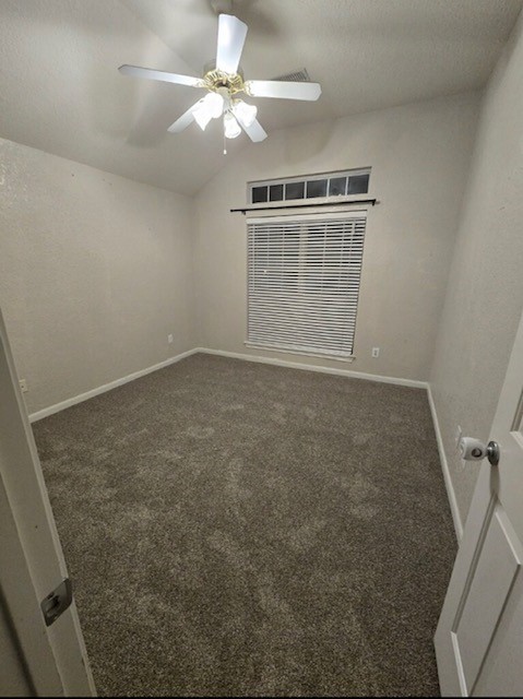 254 Maple Lane Conroe, TX 77304 - Photo 19 of 27 en empty room with windows and ceiling fan