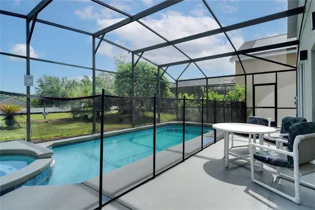 a view of a swimming pool with a patio