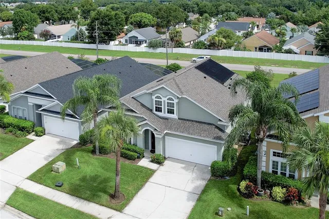 a aerial view of a house with a yard