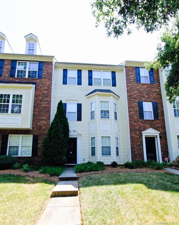 9738 Bailey Road, Unit 170 Cornelius, NC 28031 - Photo 2 of 10 a front view of a house with a yard