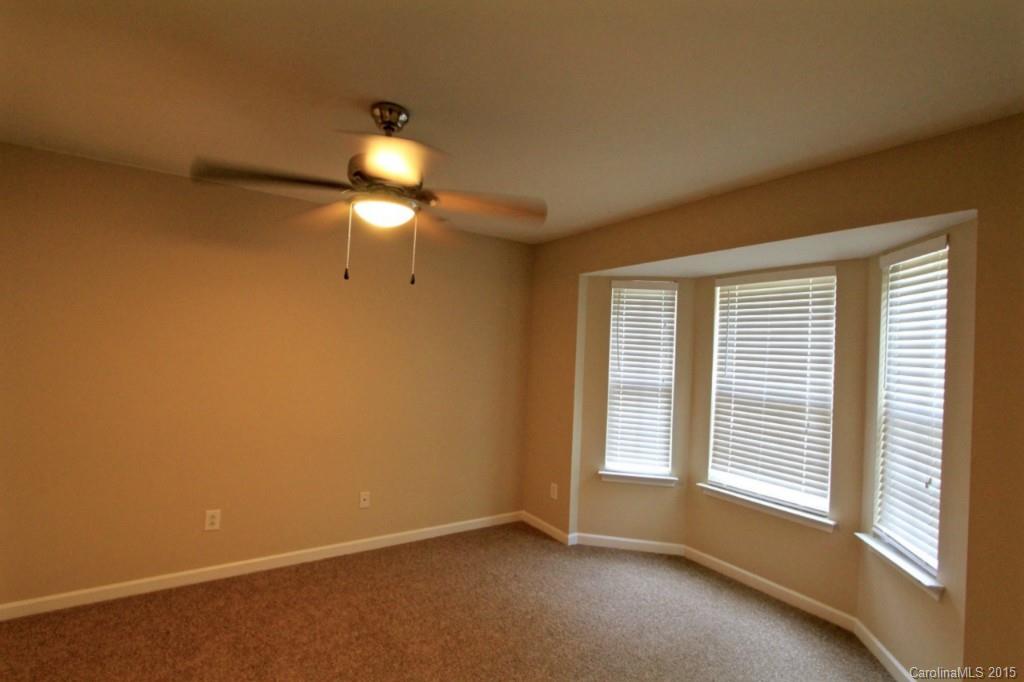 9738 Bailey Road, Unit 170 Cornelius, NC 28031 - Photo 6 of 10 a view of an empty room with a window