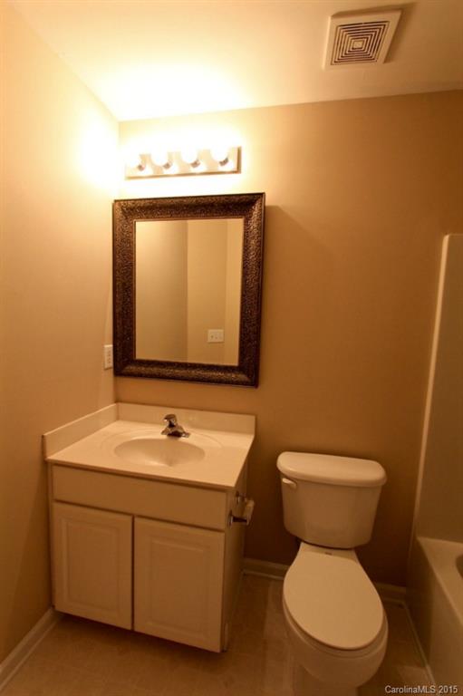 9738 Bailey Road, Unit 170 Cornelius, NC 28031 - Photo 9 of 10 a bathroom with a toilet sink and mirror