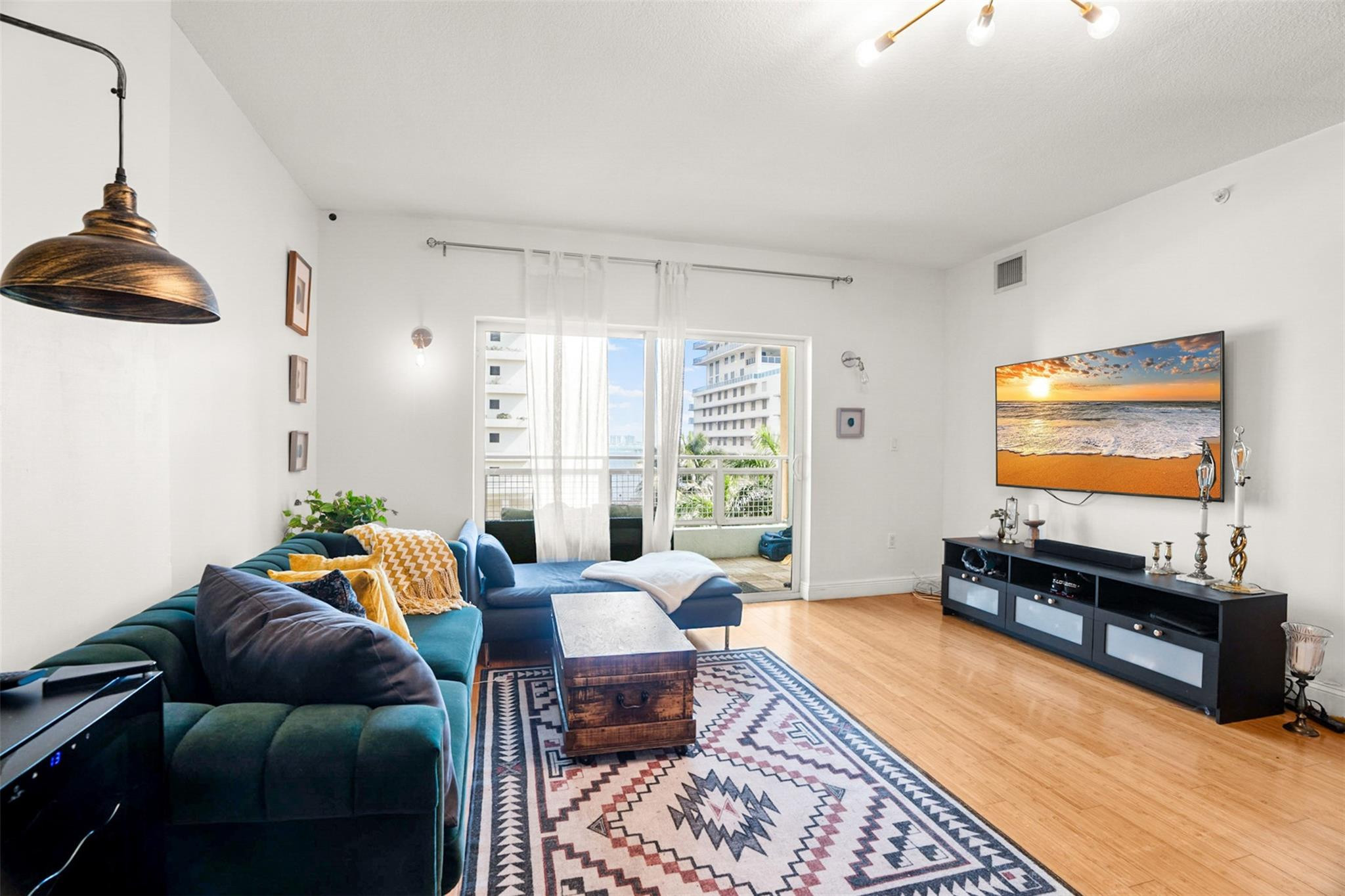 a living room with furniture and a flat screen tv