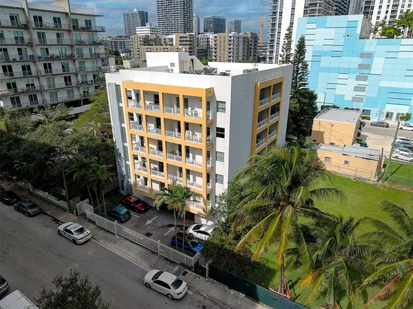 a picture of a building with yard
