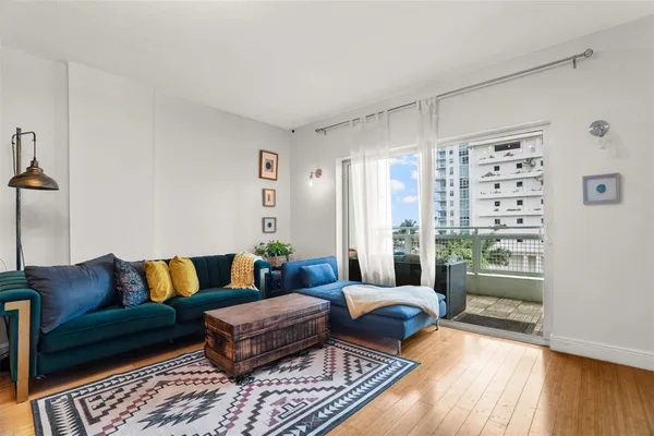 a living room with furniture and a rug