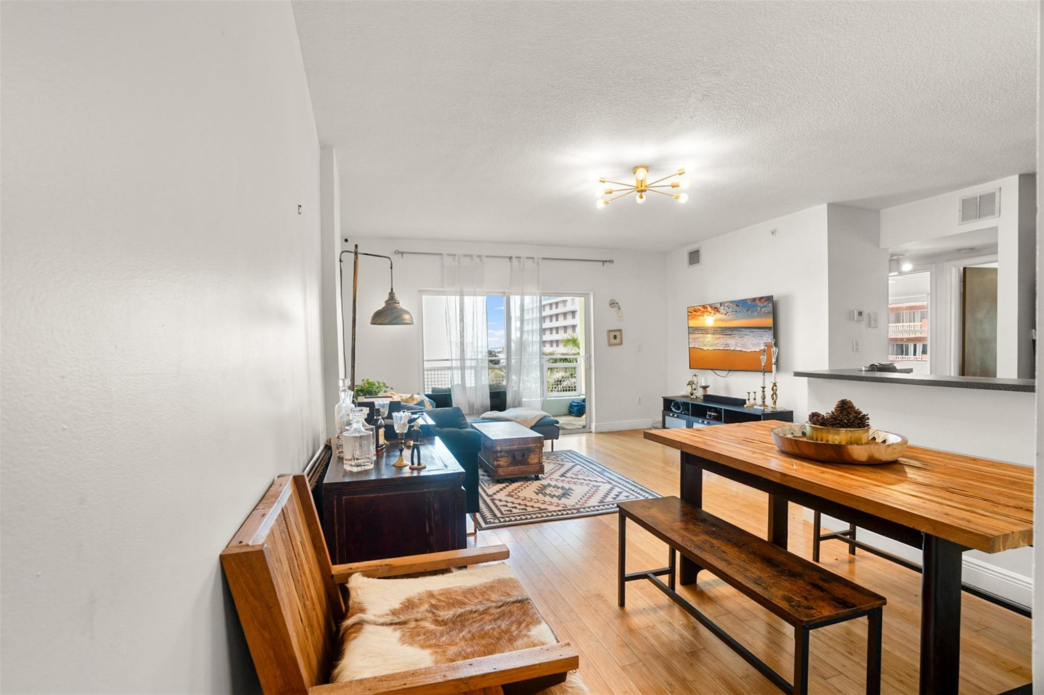 471 Northeast 25th Street, Unit 503 Miami, FL 33137 - Photo 9 of 29 a living room with furniture and wooden floor