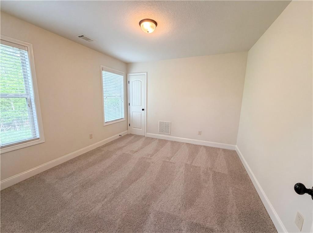1948 Paynes Point Winder, GA 30680 - Photo 16 of 22 an empty room with a window