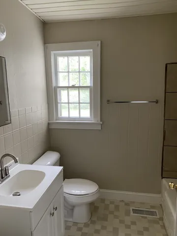 a bathroom with a sink and a toilet