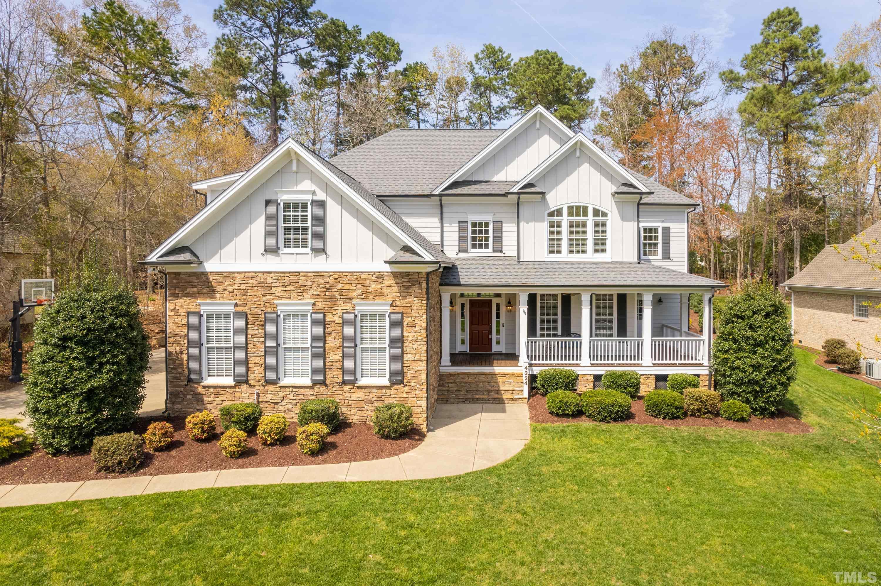 4324 Summer Brook Drive Apex, NC 27539 - Photo 1 of 70 a front view of a house with a yard