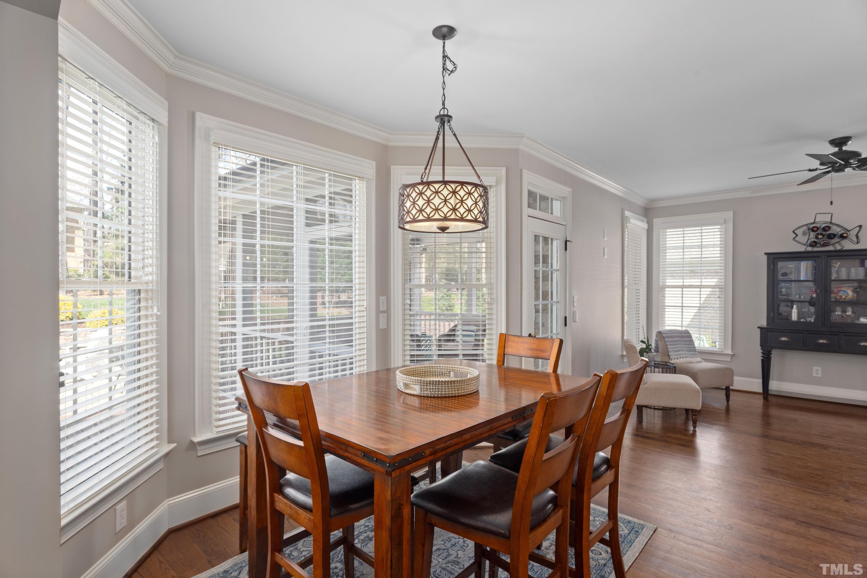 4324 Summer Brook Drive Apex, NC 27539 - Photo 15 of 70 a view of a dining room with furniture window and wooden floor