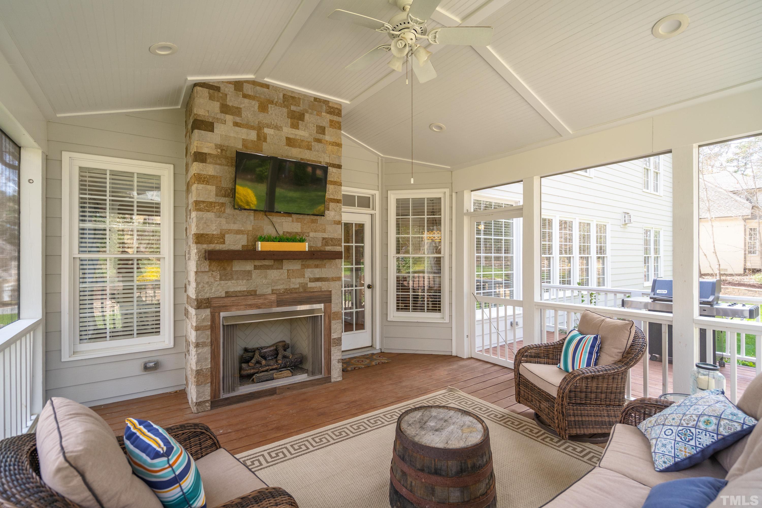 4324 Summer Brook Drive Apex, NC 27539 - Photo 21 of 70 a living room with furniture and a fireplace