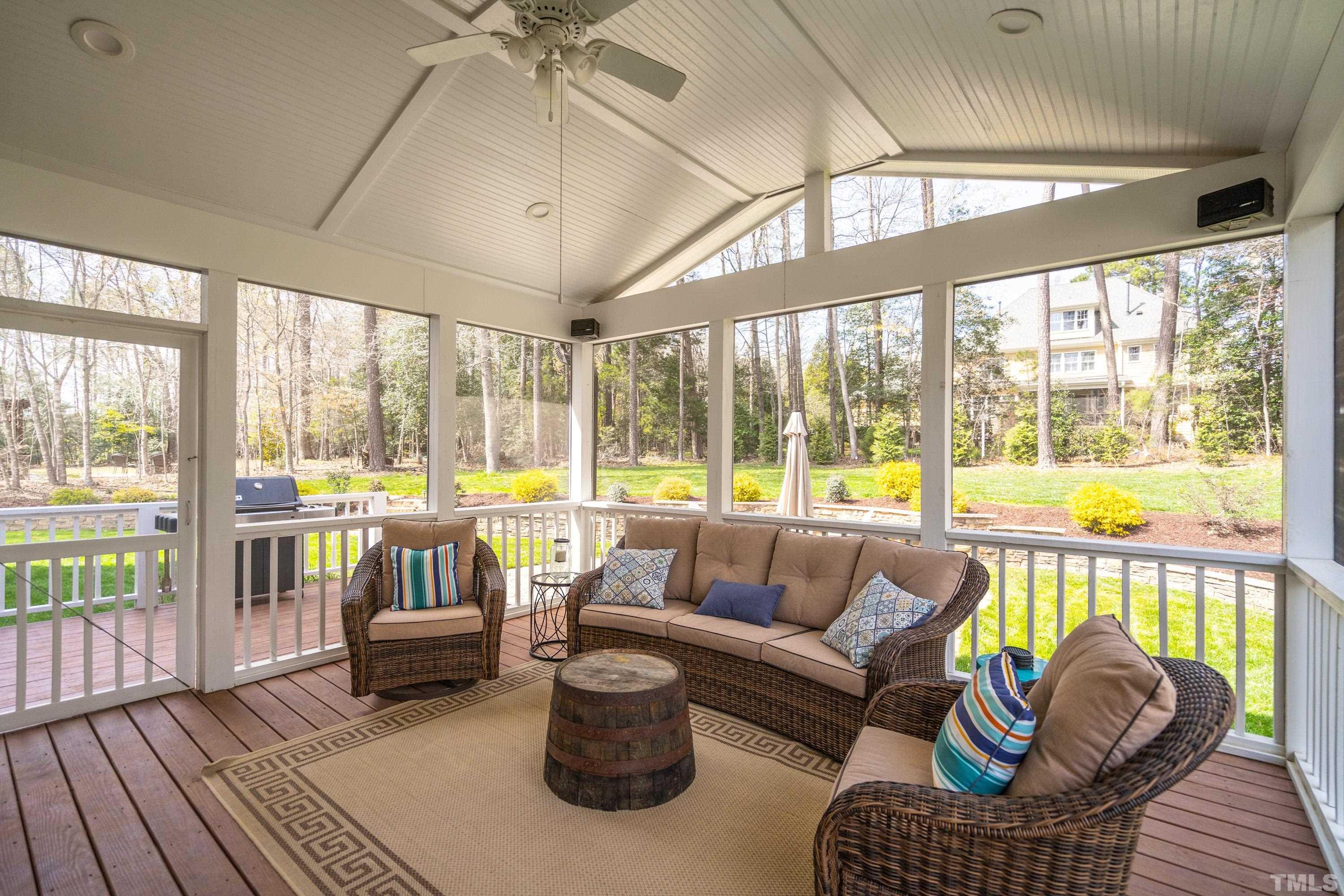 4324 Summer Brook Drive Apex, NC 27539 - Photo 22 of 70 a living room with furniture and a floor to ceiling window
