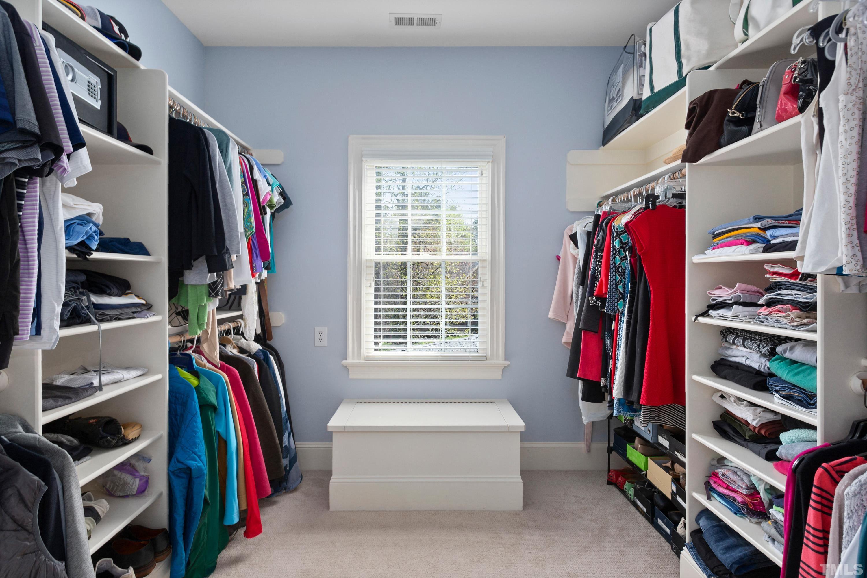 4324 Summer Brook Drive Apex, NC 27539 - Photo 28 of 70 a view of walk in closet with clothes and shoes